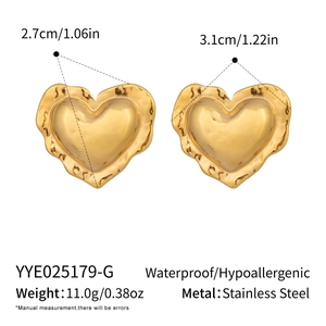 Detail showing 18K gold-plated stainless steel heart earrings with hammered texture and size marks