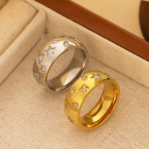 Gold and silver stainless steel rings with geometric patterns and embedded crystals
