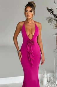 Detail of fuchsia slim fit maxi dress with deep V-neck and floral ruffle waist decor