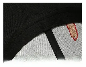 Detail of widened sweatband and precision stitching inside the black baseball cap