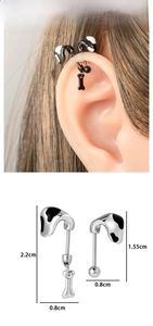 Detail of cow print titanium earrings with dimensions and bone pendant accent