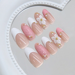 French blush style almond press-on nails with 3D pearl flowers and pink marble texture