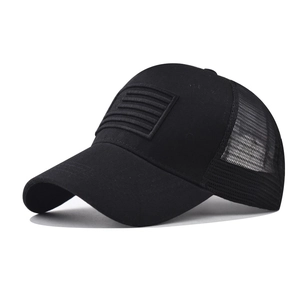 Classic black mesh baseball cap featuring an embroidered American flag and washed denim brim