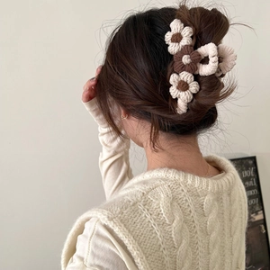 Plush flower hair claw clip in beige and brown for women's elegant winter hairstyles