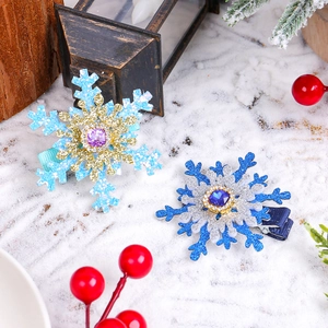 Sparkling snowflake rhinestone hair clips with glitter fabric and central gems for winter