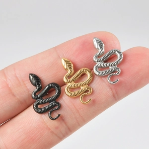 Punk style snake shaped tongue rings in black, gold, and silver stainless steel
