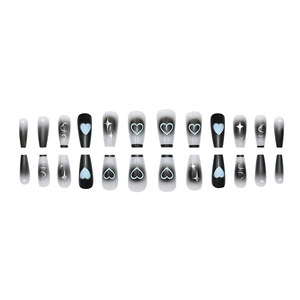 Long trapezoidal press-on nails with black gradient, blue hearts, and silver stars