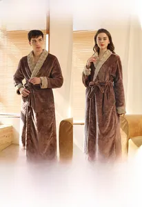 Front view of male and female models wearing thick dark brown flannel bathrobes