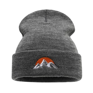 Dark grey ribbed knit beanie with mountain and sun embroidery on the folded cuff