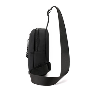Side view of a minimalist black water-resistant men's chest bag made of durable nylon fabric