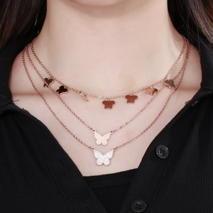 Three-layer rose gold stainless steel necklace with butterfly pendants and crystal accents