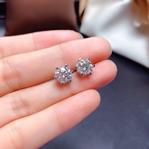 Classic six-prong round cut moissanite stud earrings in silver tone setting