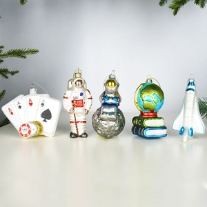 Five-piece set of hand-painted glass Christmas ornaments with astronaut and space themes