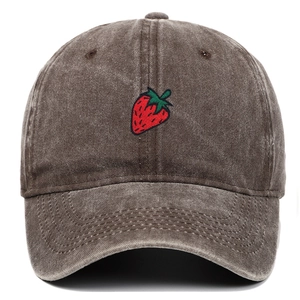 Close-up of strawberry embroidery on vintage washed dark brown cotton baseball cap