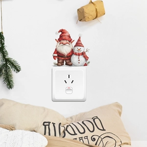 Christmas light switch wall stickers featuring festive gnome and snowman decorations
