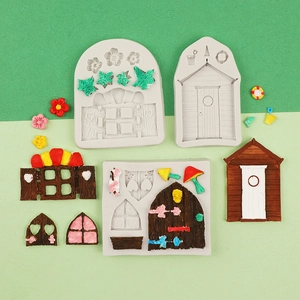 Macro shot of 3D fairy house door and mushroom silicone molds with painted clay samples