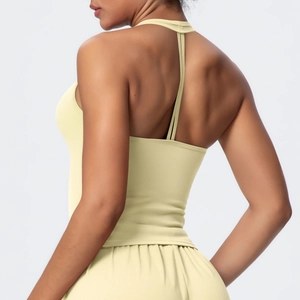 Detailed back view of light yellow V-neck sports bra with thin crossover straps