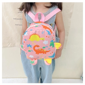 Detail view of cute pink dinosaur cartoon backpack for kids with waterproof fabric and zippers