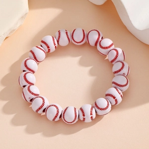 Close-up of baseball themed beaded bracelet with white acrylic beads and red stitch details