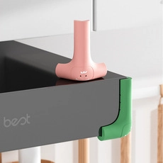 Estensore per rubinetto a balena rosa e paraspigoli in silicone verde per la sicurezza dei bambini