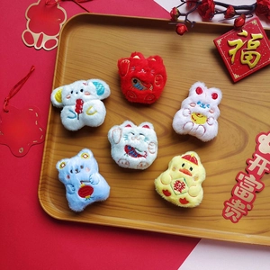 Cartoon plush brooches set with lucky cat and rabbit featuring festive embroidery