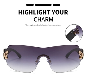 Detail view of gold butterfly hinge on frameless oversized gradient purple sunglasses