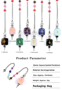 Macro detail of natural stone pendulum charms with golden symbols and size dimensions