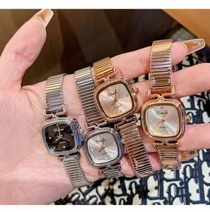 Macro detail of luxury square quartz watches with elastic steel straps in four metal finishes