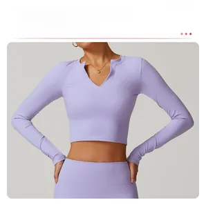 Detail of light purple cropped yoga top with V-neckline and compression fabric texture