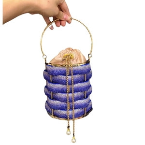 Blue rhinestone bucket bag with golden metal handle and tassels for formal party events