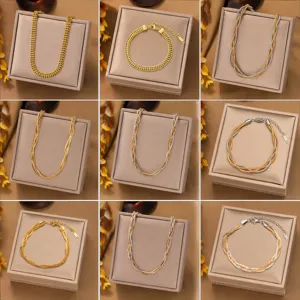 Detailed set of gold and bicolor link chains, rope chains and flat necklaces on display