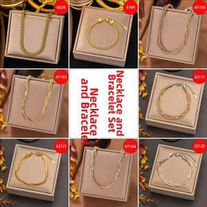 Detailed set of gold and bicolor link chains, rope chains and flat necklaces on display