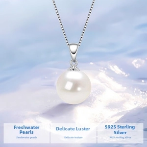 Detailed macro of a freshwater pearl pendant on a S925 sterling silver chain