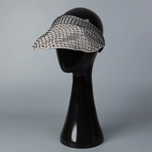 Beige sun visor hat with black mesh and rhinestones on a mannequin head