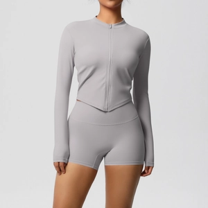Detail of grey high-stretch yoga set with full-zip sports jacket and slim-fit shorts