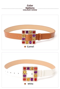 Close-up of leather belts in white and camel with colorful gemstone square buckles