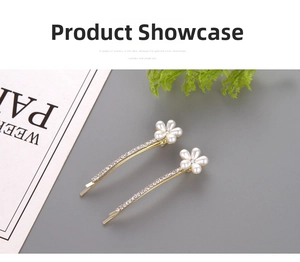 Macro view of gold pearl hair clips with rhinestones and floral pearl details