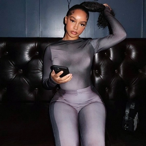 Close-up of grey gradient pattern on a slim-fit high-neck long-sleeve jumpsuit
