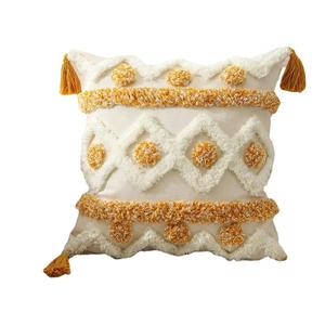 Boho tufted throw pillow cover with yellow diamond patterns and decorative corner tassels