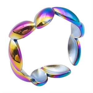 Macro detail of rainbow stainless steel adjustable ring with leaf design and metallic luster
