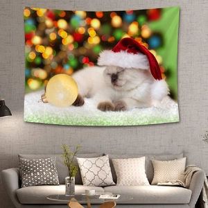 Detail of Christmas wall tapestry featuring a sleeping kitten and golden ornaments