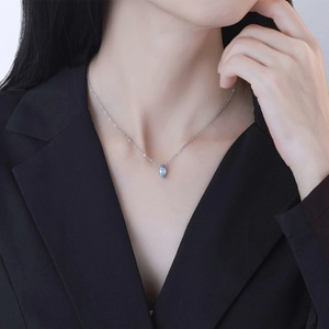 S925 sterling silver necklace with a marquise-cut sea blue zircon pendant on a model