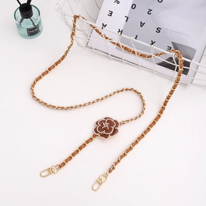 Detail of brown leather gold chain strap with pearl camellia flower and lobster clasps