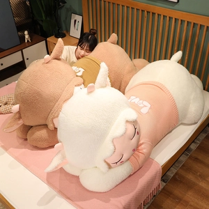 Detailed view of large plush sleeping lambs in knitted Love sweaters for home decor