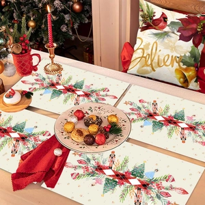 Christmas table decoration set featuring Nutcracker placemats and festive Believe pillow