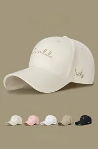 Detail of embroidered Lucky lettering on the side of a high-quality cotton baseball cap