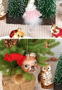 Detailed view of hand-painted glass Christmas ornaments with diverse animal characters