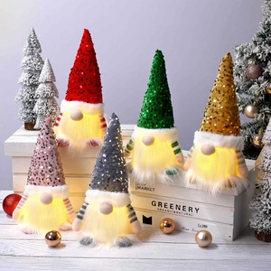 Set of 5 lighted Christmas gnomes with sequin hats and warm LED glow for holiday decor
