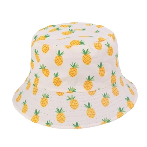 Detail of baby sun hat with yellow pineapple print on cream fabric background