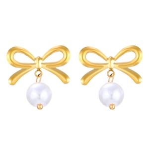 Close-up of golden bow earrings with white pearl pendants on a clean white background